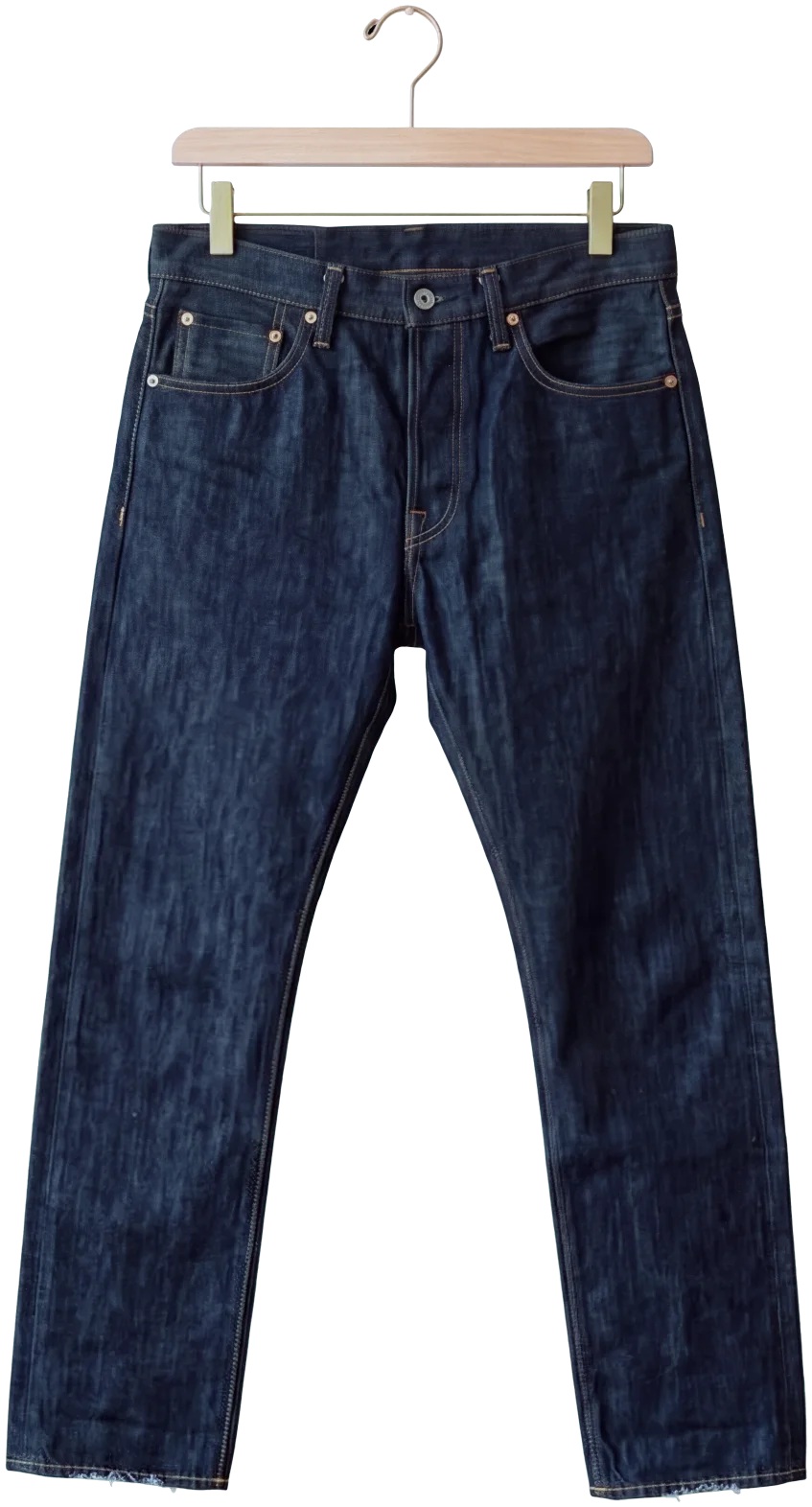 Raw indigo selvedge jeans on a wooden clip hanger